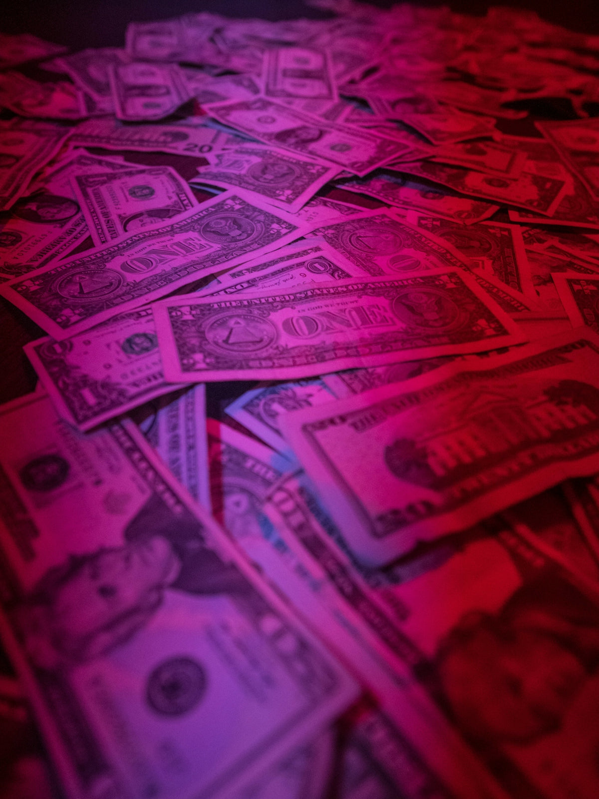 a pile of money sitting on top of a table