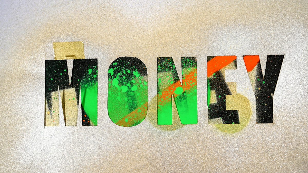 The word MONEY stenciled in black with green and orange spray paint on gold